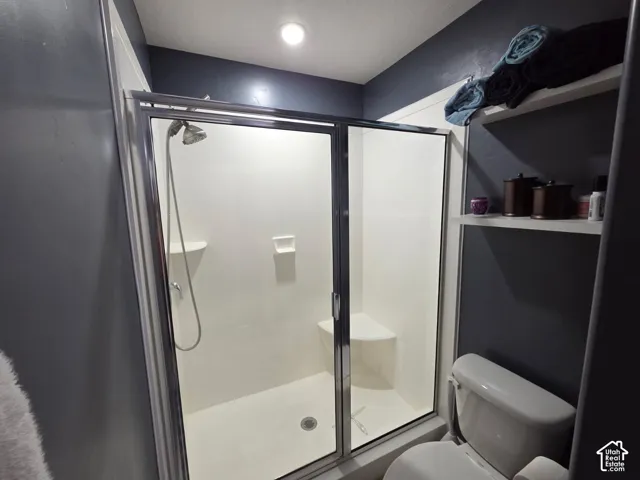 Walk-in shower with sliding glass enclosure