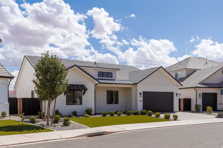Modern exterior with white siding and shingle accents