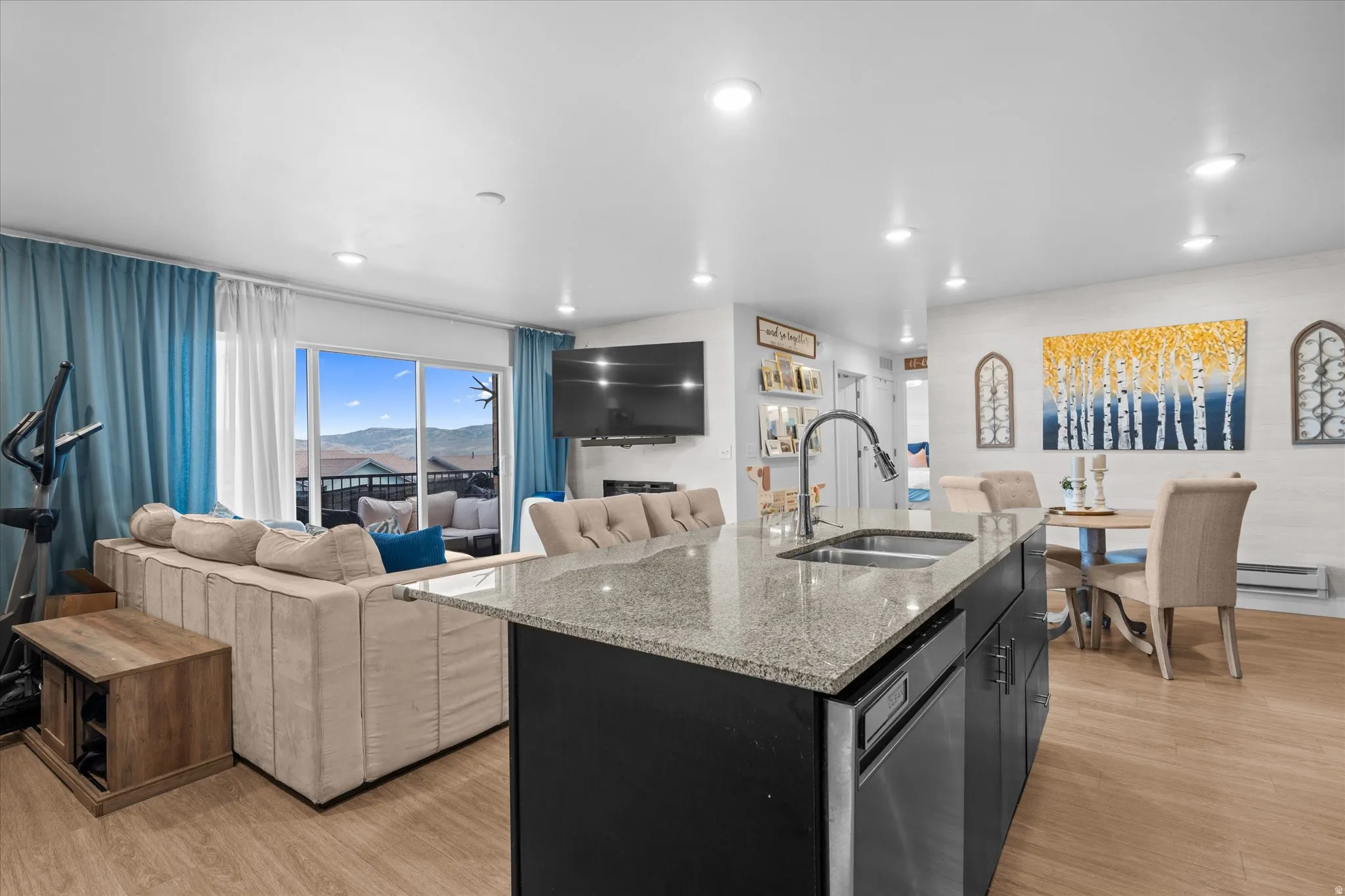 Kitchen island with granite countertop and stainless steel sink