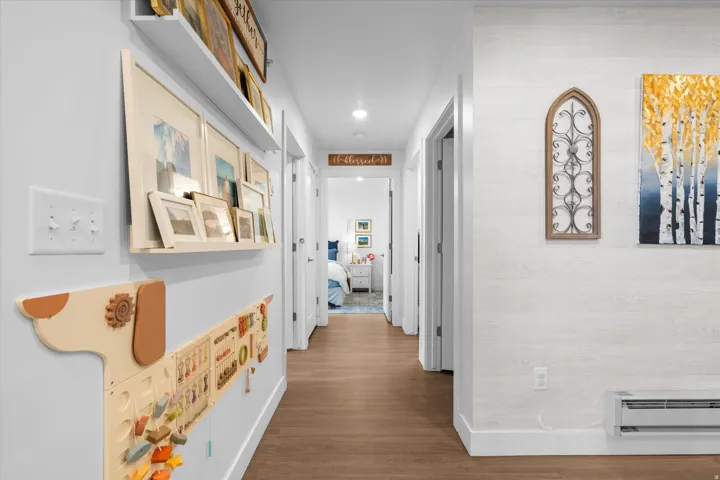 Wood-finish flooring extending through the hallway