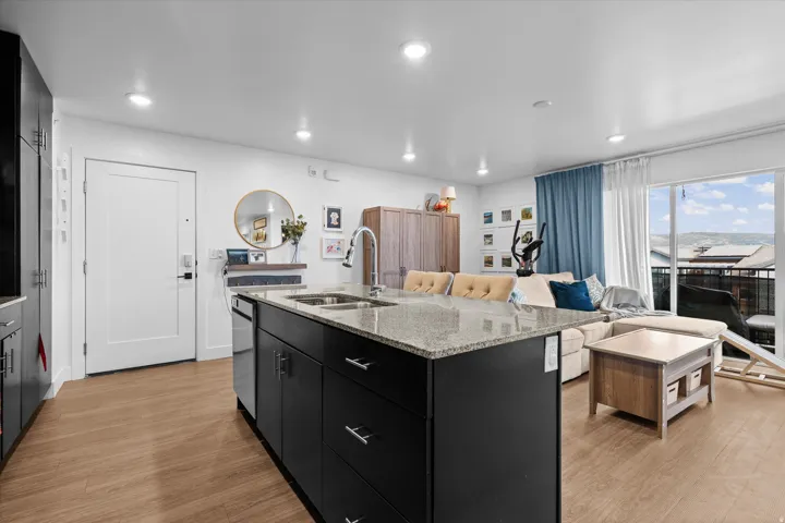 Kitchen island with granite countertop and double stainless steel sink