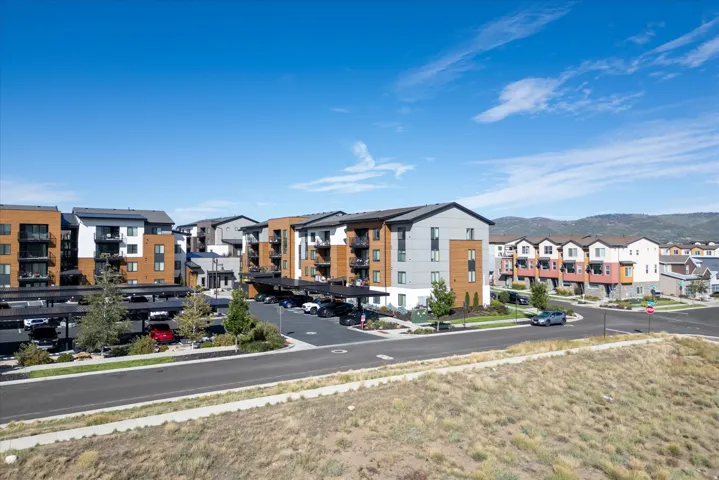 Contemporary multi-story buildings featuring varied facades and private balconies