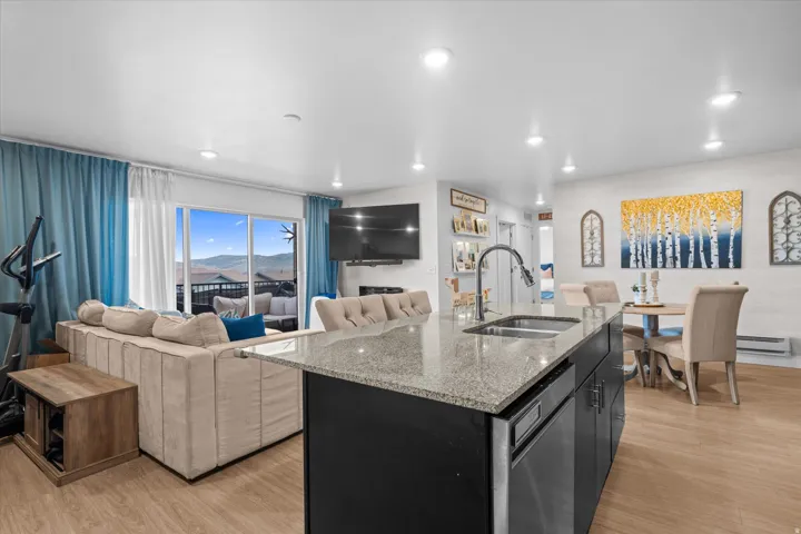 Kitchen island with granite countertop and stainless steel sink