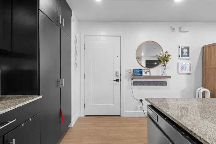 Wood-finish flooring with white baseboards