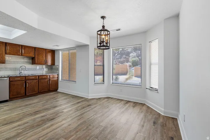 Wood-finish flooring throughout the space