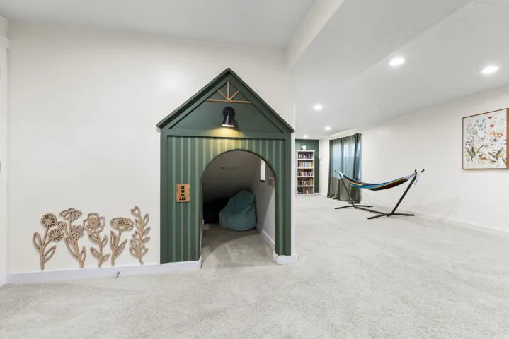 Built-in archway feature, recessed lighting, wall-to-wall carpeting, built-in shelving, decorative wall accents