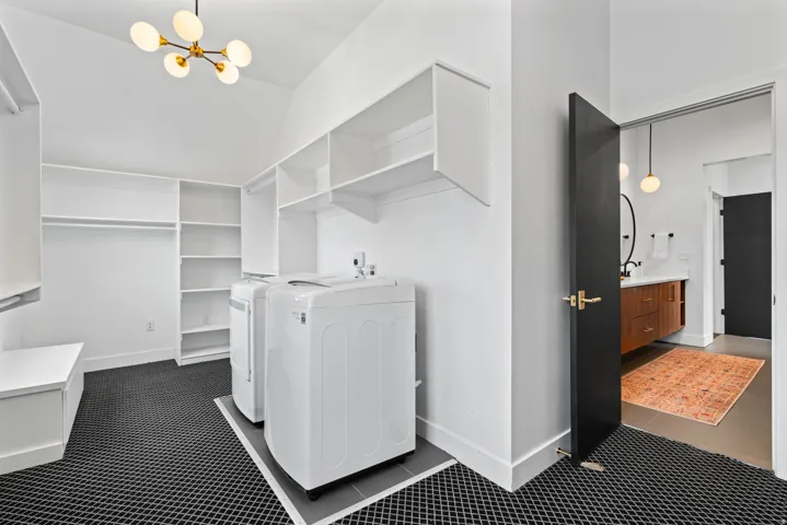 Primary bedroom closet 1 with washer and dryer