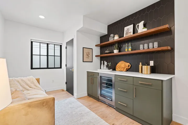 Dry bar with a wine refrigerator,