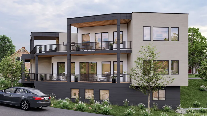 Modern multi-story facade featuring light-toned masonry and dark siding