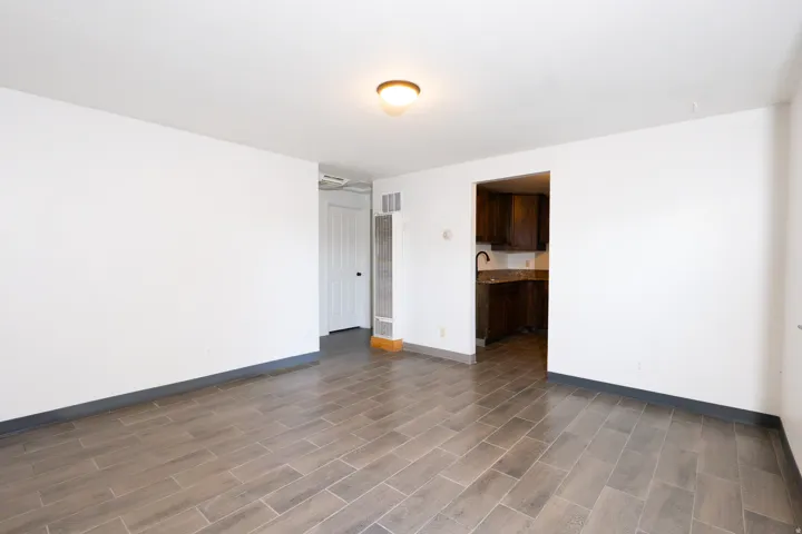 Tile flooring throughout with a warm wood-finish