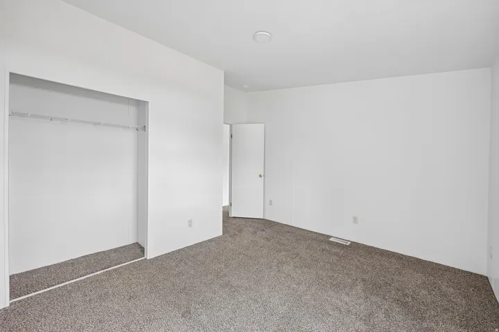 Wall-to-wall carpeting with a neutral tone