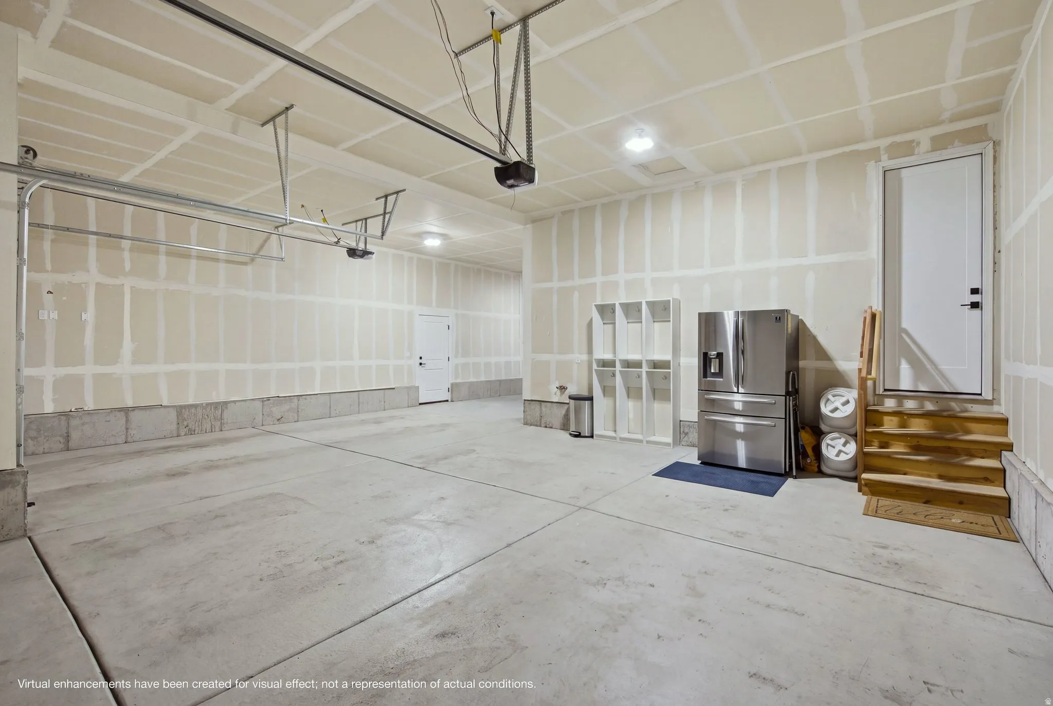 Concrete flooring, recessed lighting, white door, wooden stairs, concrete foundation.