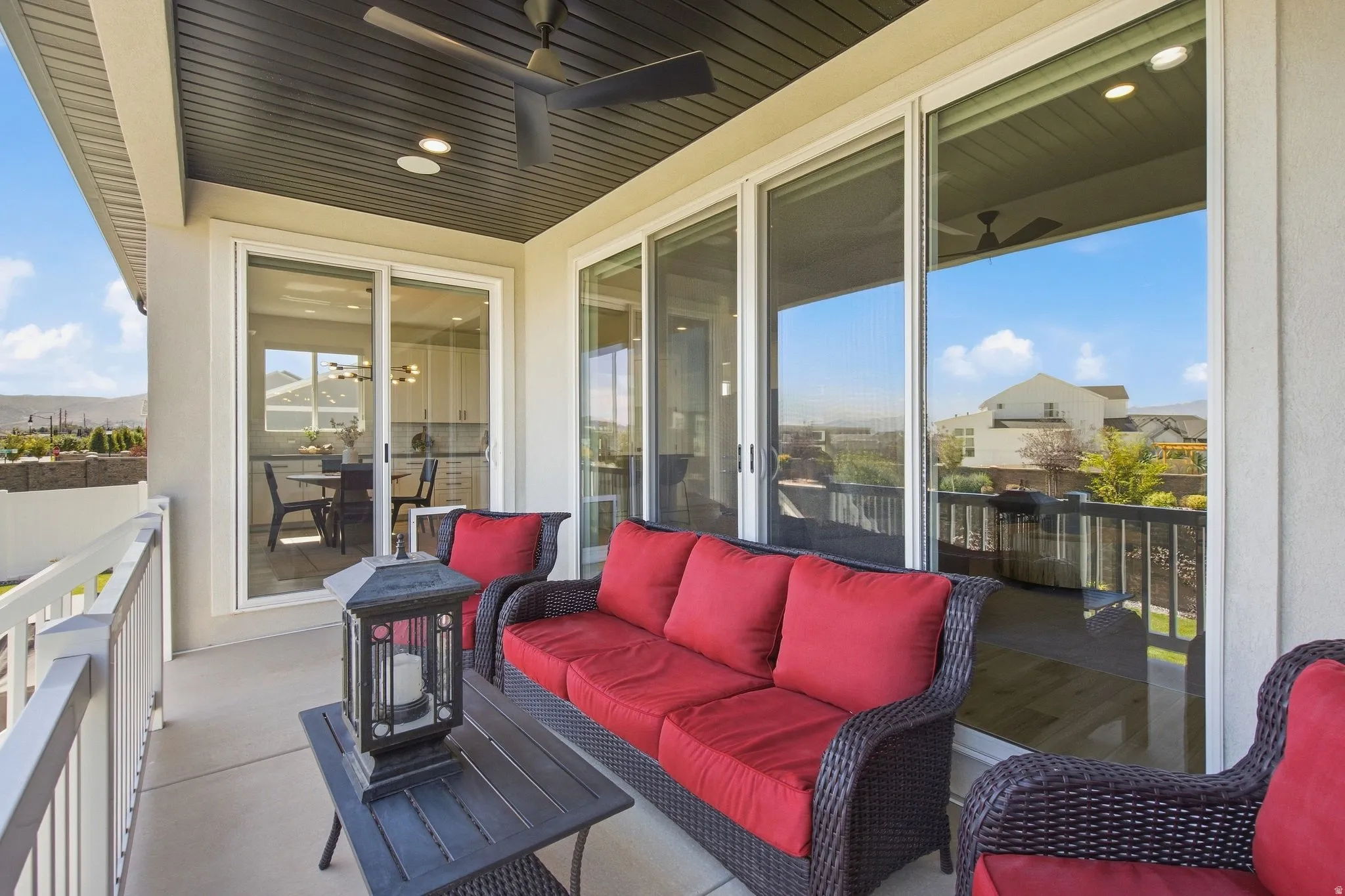 Covered outdoor patio with a dark finish ceiling, recessed lighting, and a ceiling fan.