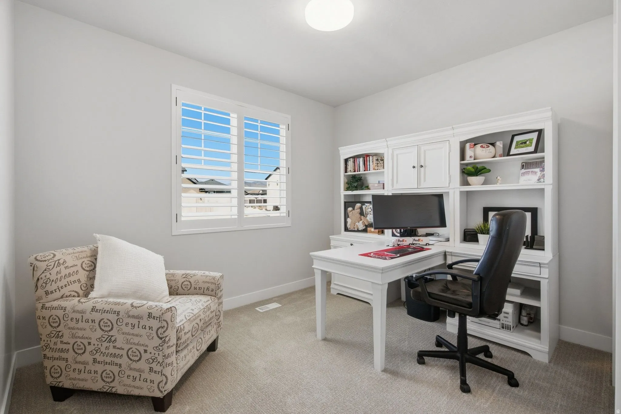 White shutters, and light neutral carpeting.