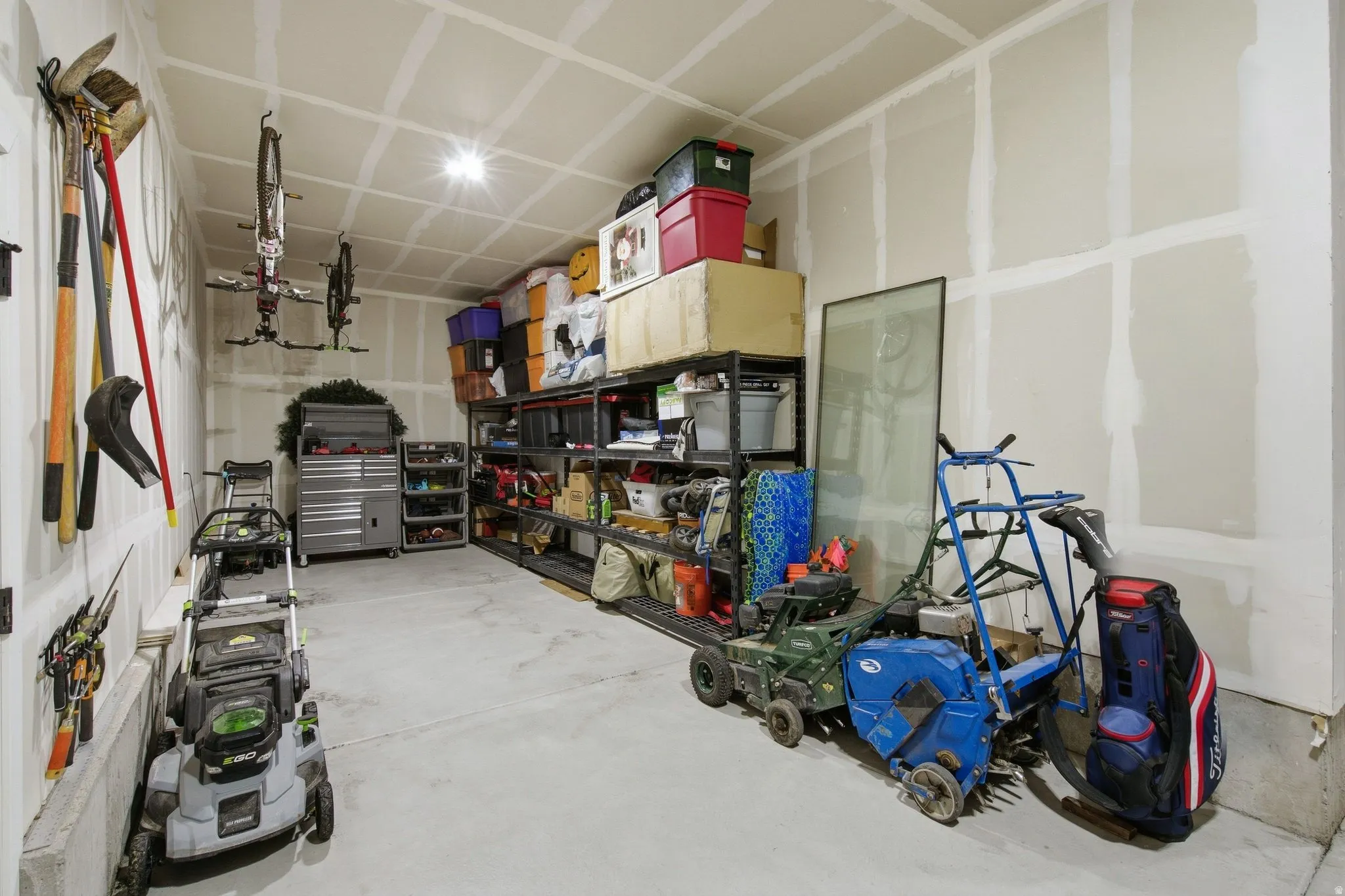 Tandem deep garage perfect for another vehicle, storage or a work shop space.