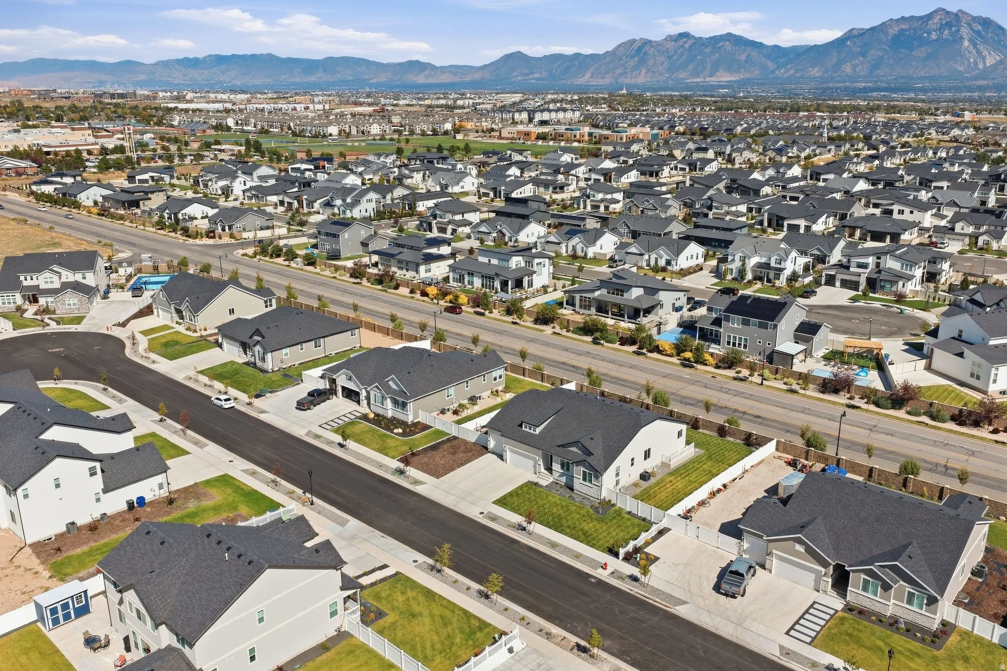 Residential neighborhood, paved streets, and mountainous backdrop.