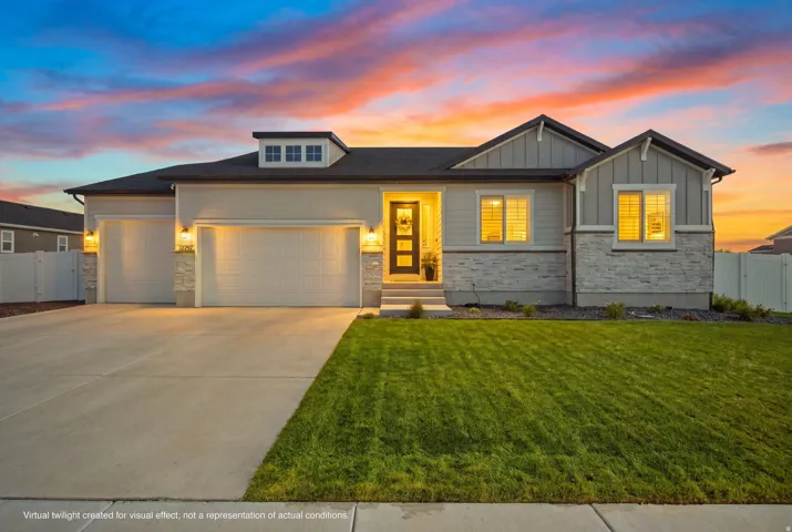 Contemporary rambler with a 4-car garage, stone and siding exterior, front yard, and concrete driveway