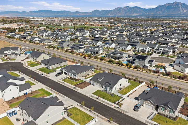 Residential neighborhood, paved streets, and mountainous backdrop.