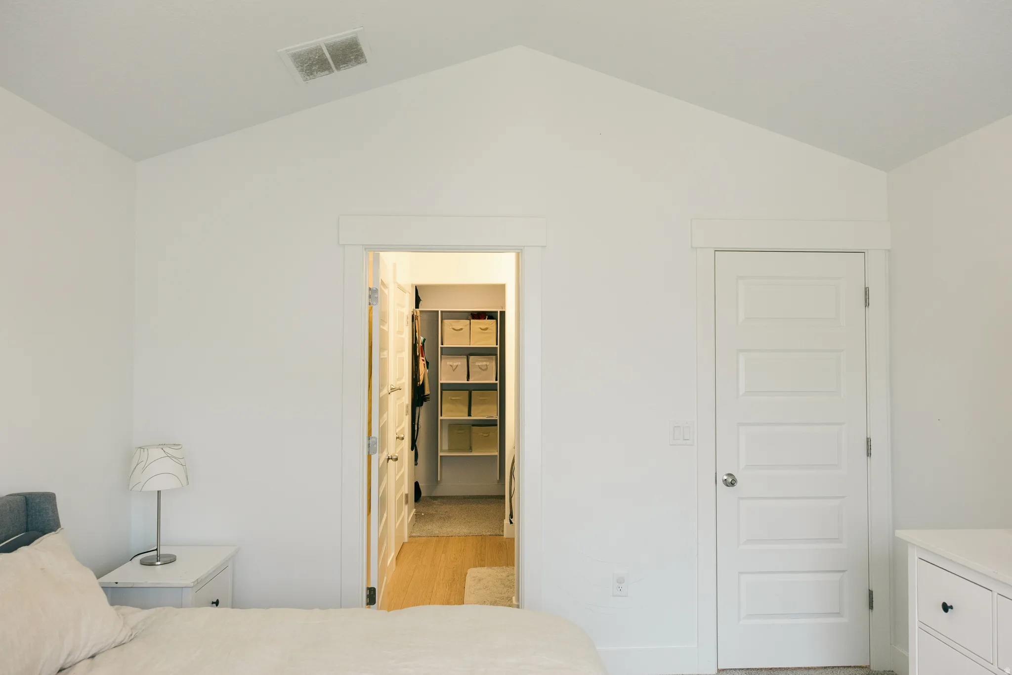 Vaulted ceiling and white walls