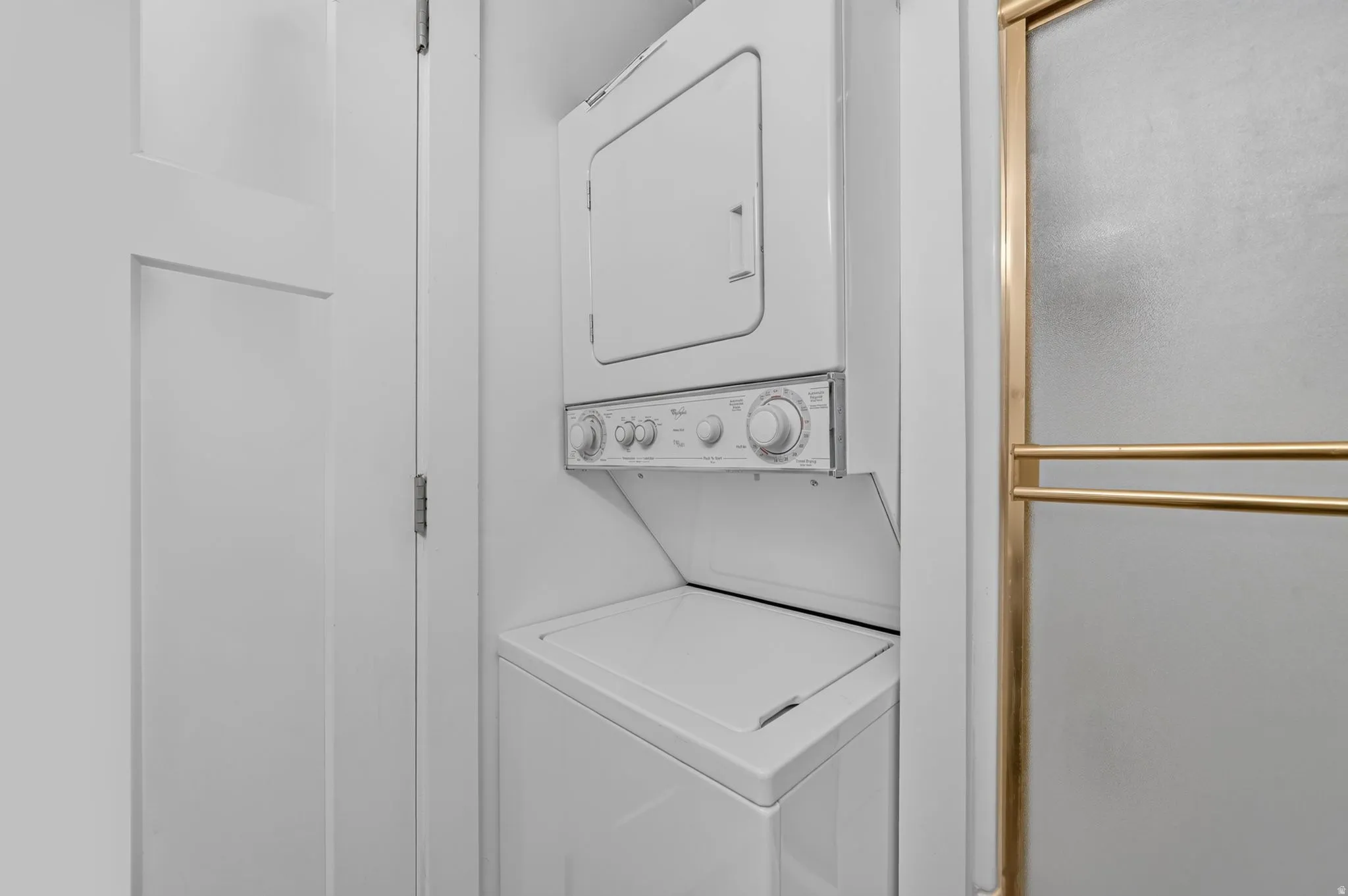 Stacked washer and dryer unit
