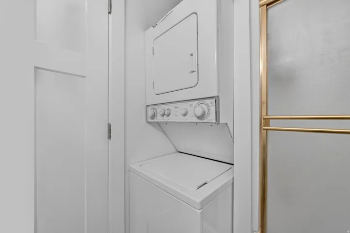 Stacked washer and dryer unit