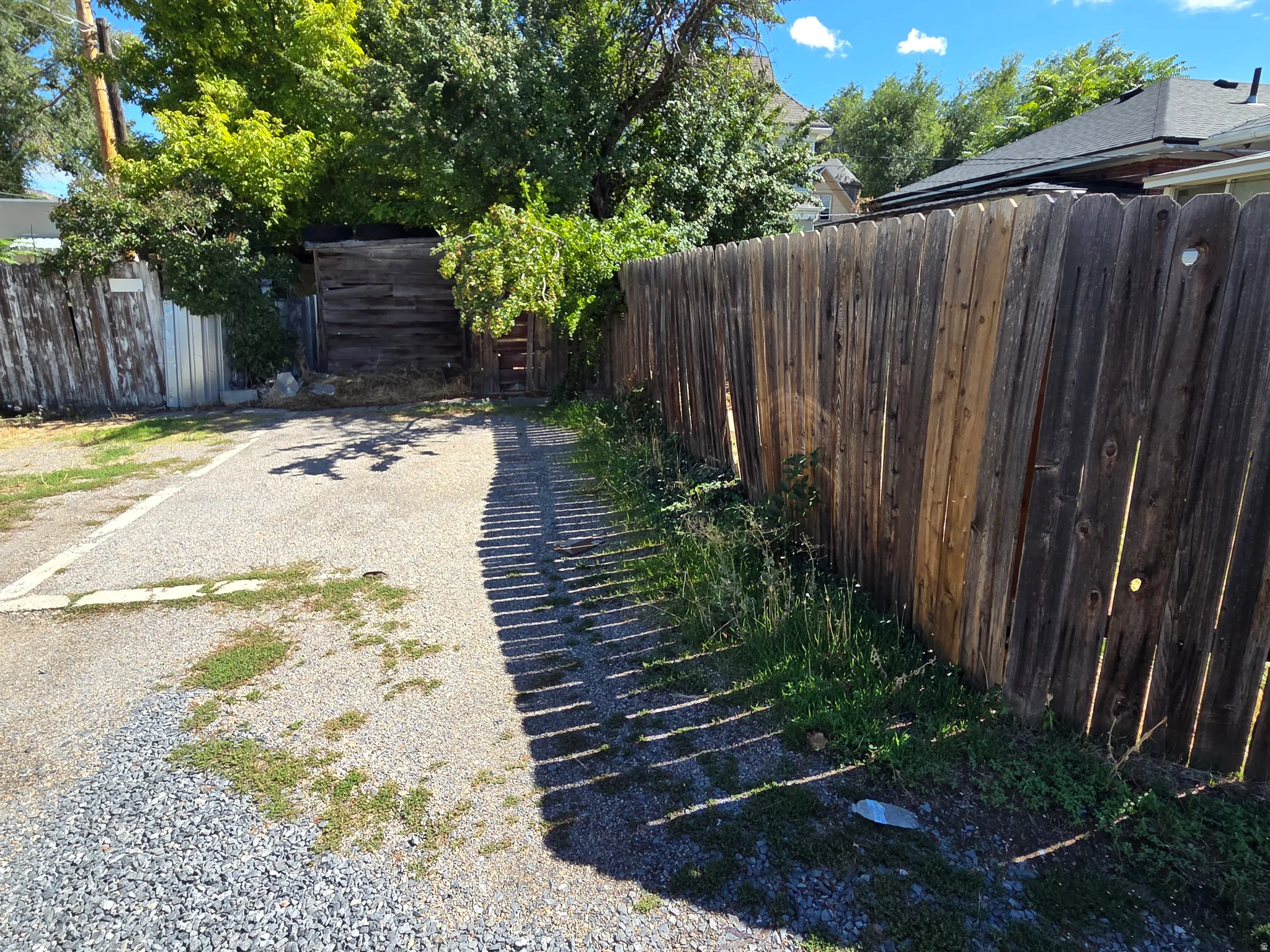 Gravel driveway with wood fencing