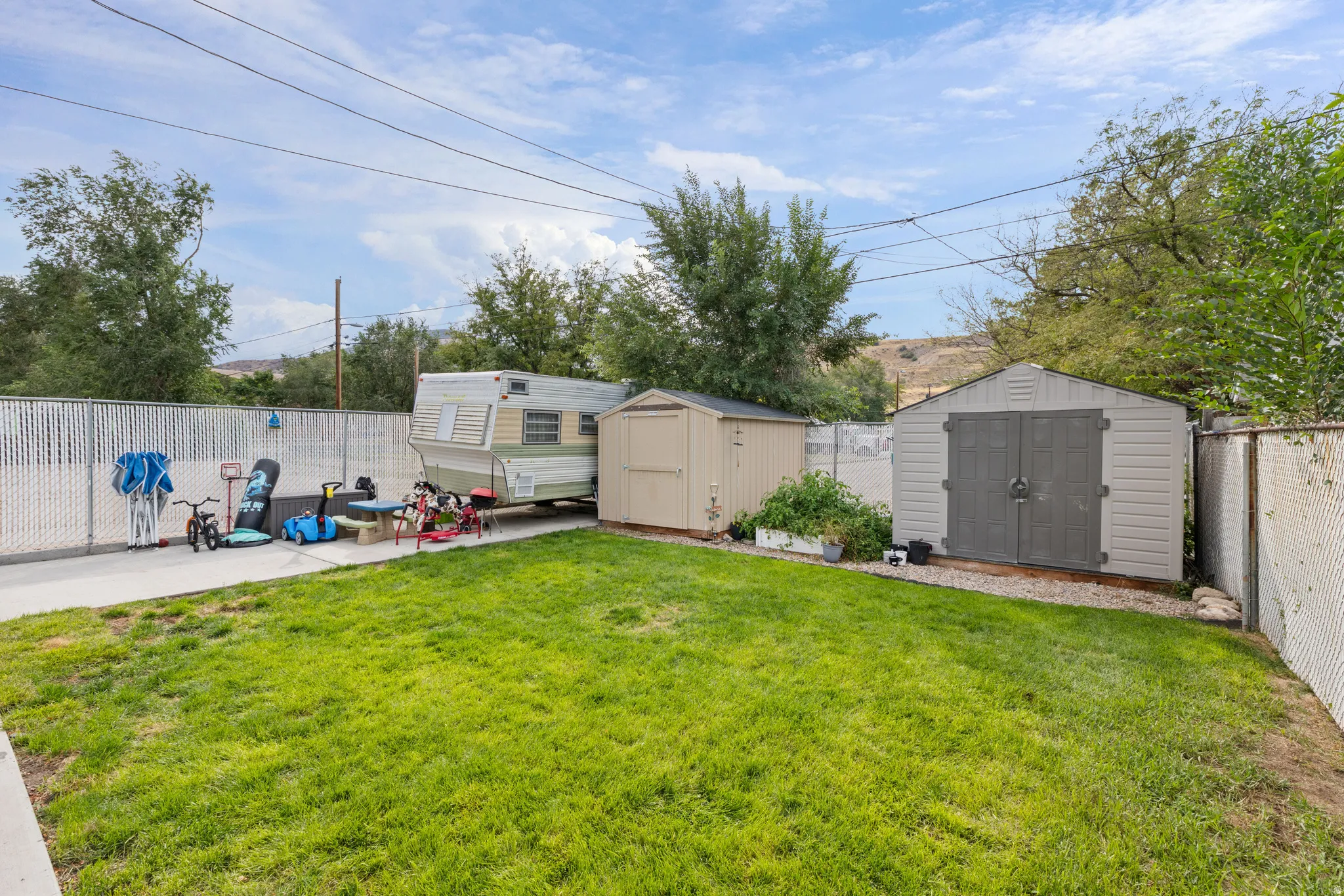 Concrete RV Pad. TWO Sheds