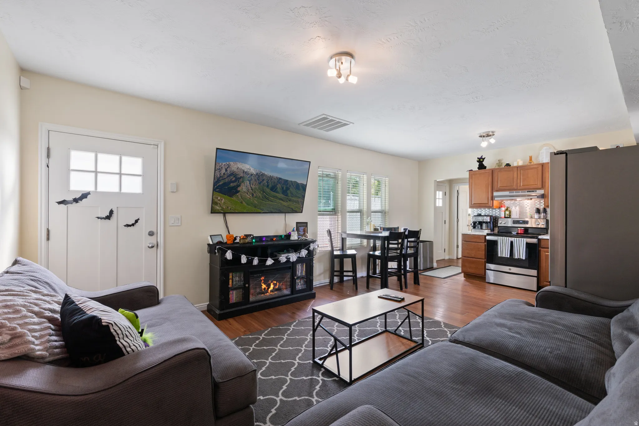 Front Door opens to Open Concept Living Space
