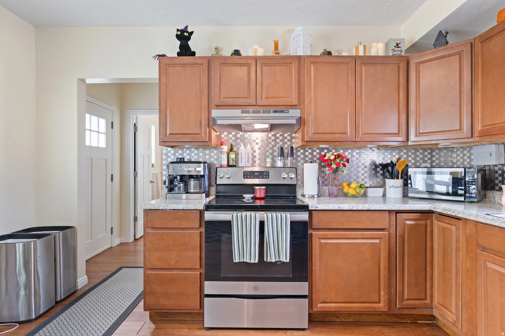 Kitchen leads to back door, Bathroom,  Mudroom, Laundry Room.