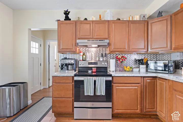 Kitchen leads to back door, Bathroom,  Mudroom, Laundry Room.