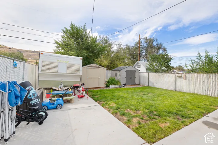 RV Parking. Grassy area. Fenced. Two Sheds.