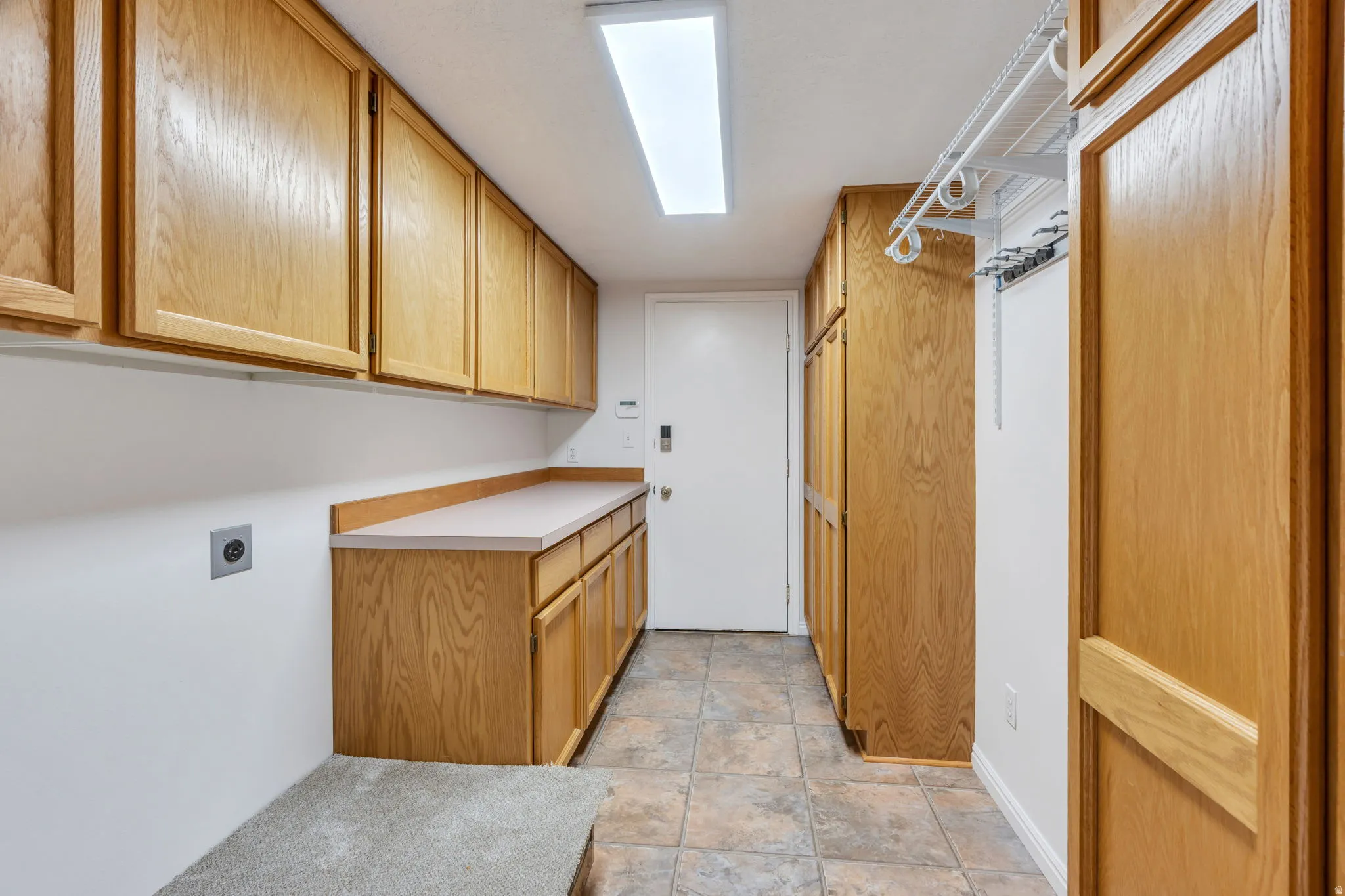 Laundry stubbed for both Gas and Electric Dryer.  Plenty of countertop space and cabinets.