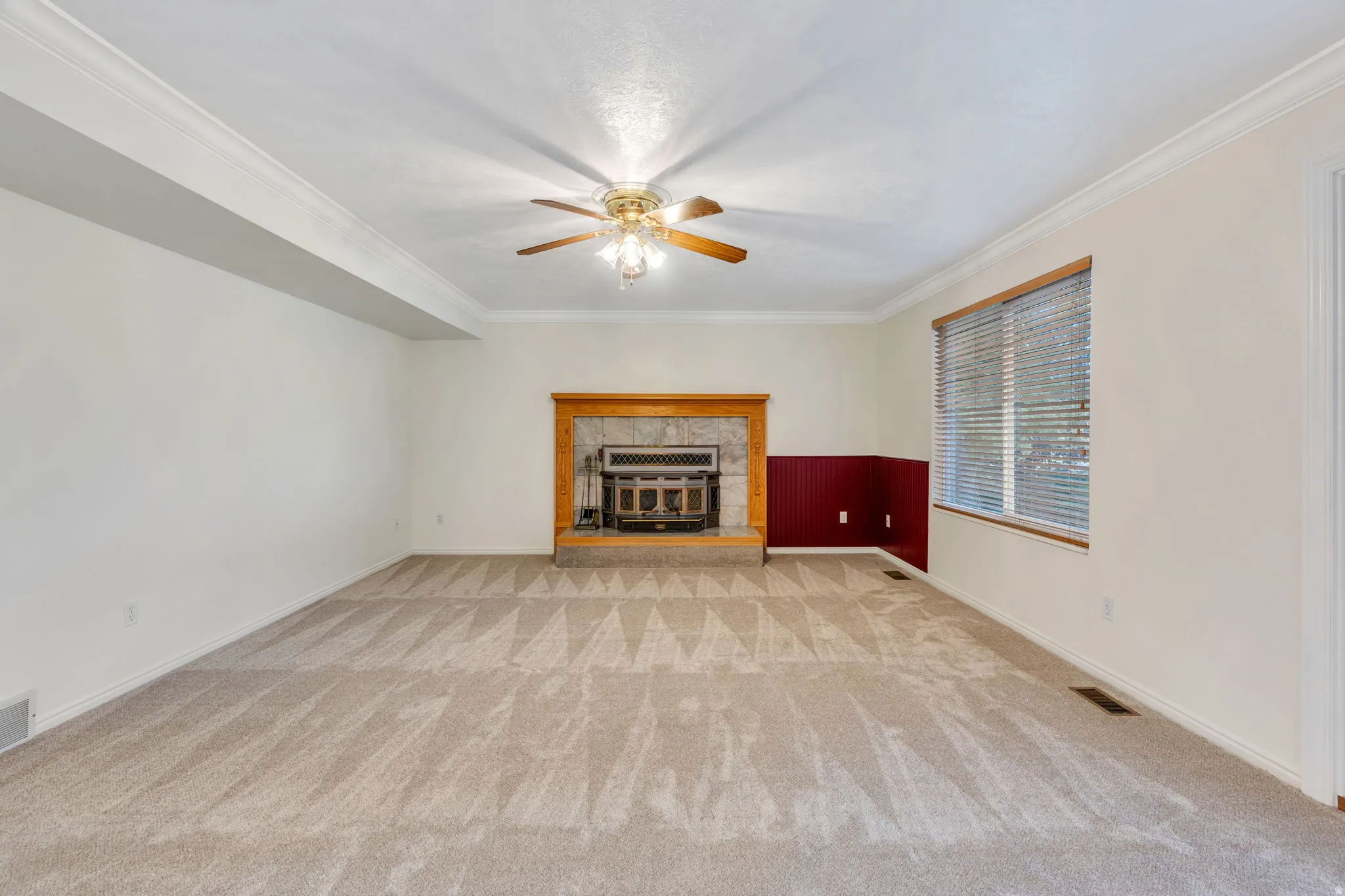 Recessed Wood fireplace with stone surround and wood mantle