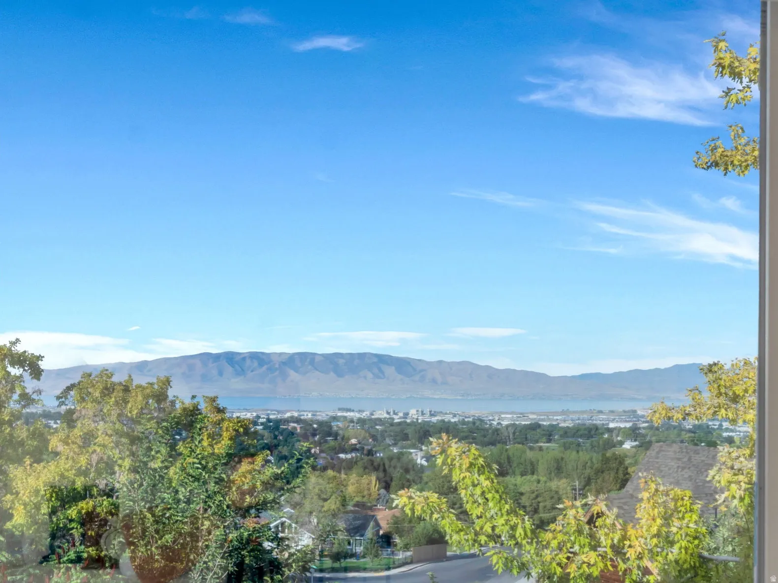 Views from the Primary Bedroom Suite!!  Framed window offering expansive scenery of distant mountains, Utah lake and surrounding greenery