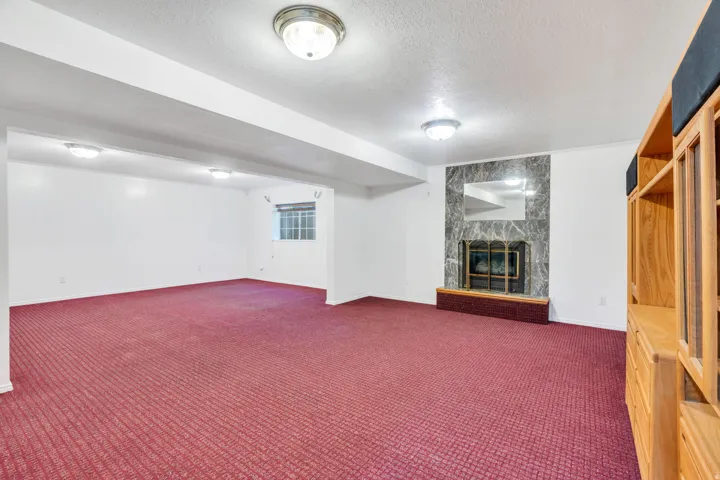 Basement: Spacious Great room with gas fireplace and a window!
