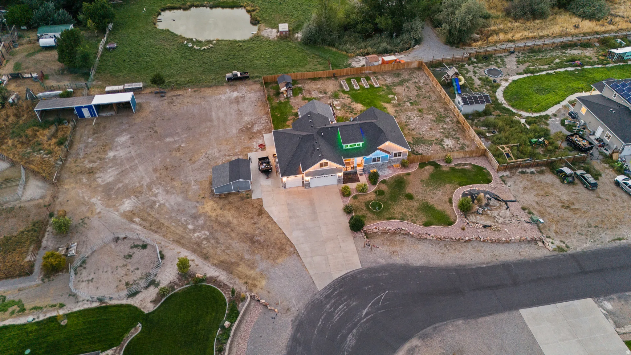 Single-story residence with a dark shingle roof, attached garage, and a light-toned exterior