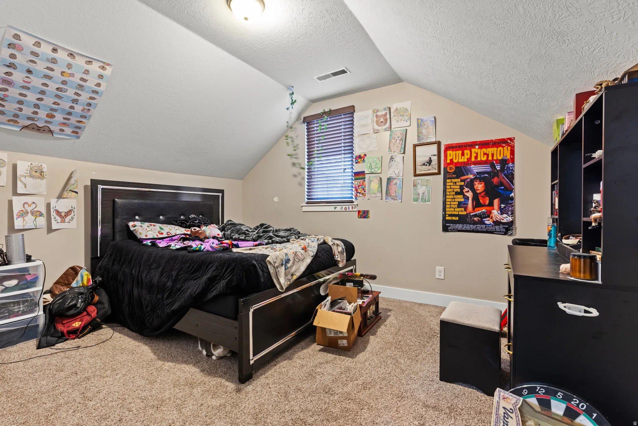 Sloped ceiling room featuring a window with blinds, recessed lighting, and carpeting