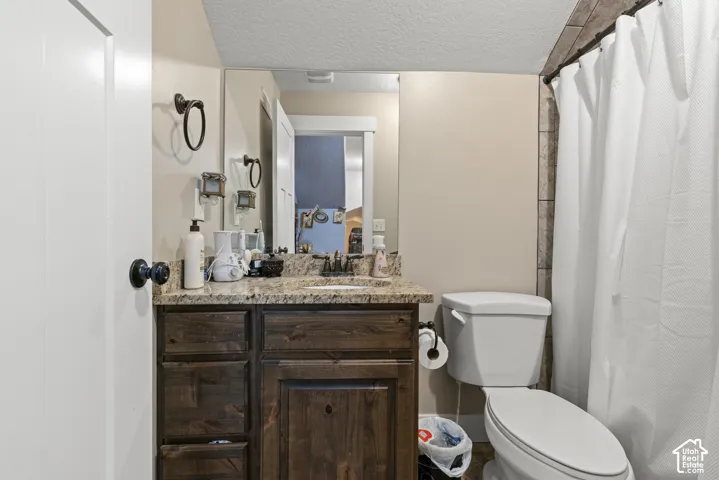 Wood-finish vanity with granite-style countertop