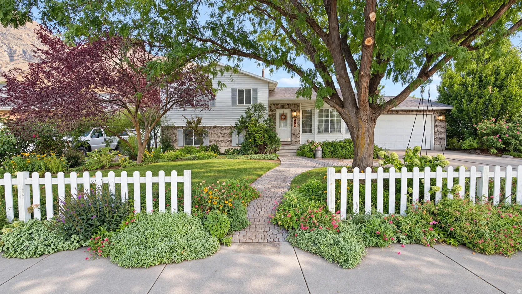 White siding and stone veneer exterior