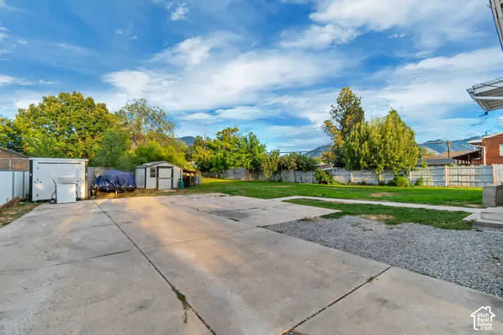 Expansive paved driveway with additional gravel parking