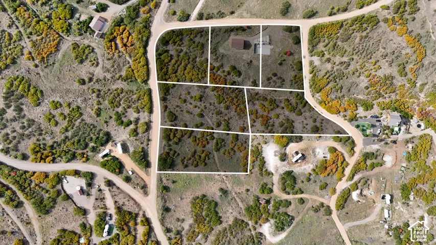 Addditional Land Available, Aerial view of multi-parcel land featuring native vegetation, diverse topography, and gravel road access