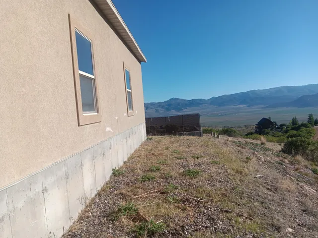 Stucco exterior with concrete foundation