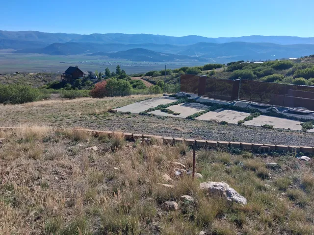 Mountainous landscape with distant residences