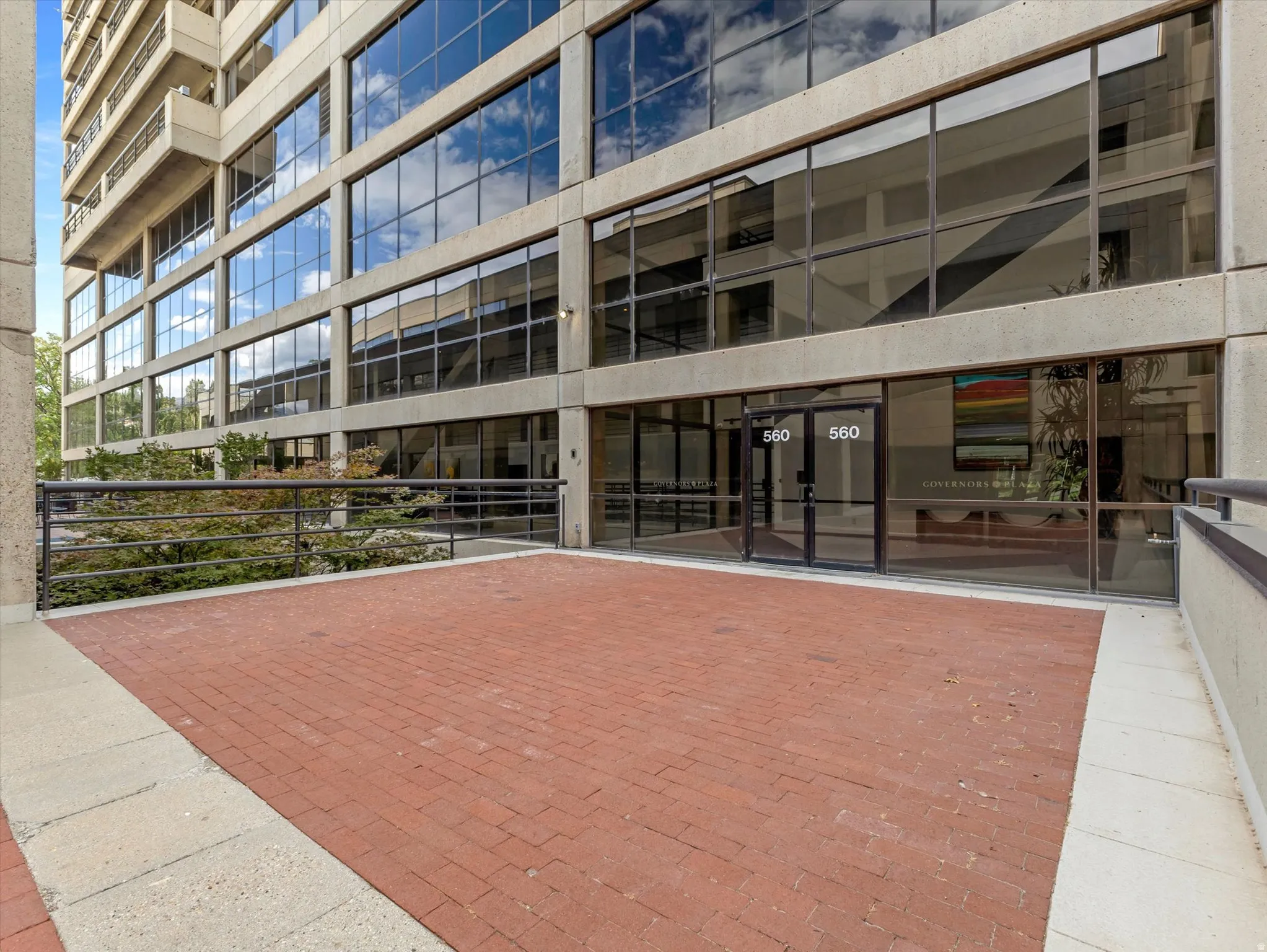 Brick paver patio with a concrete border