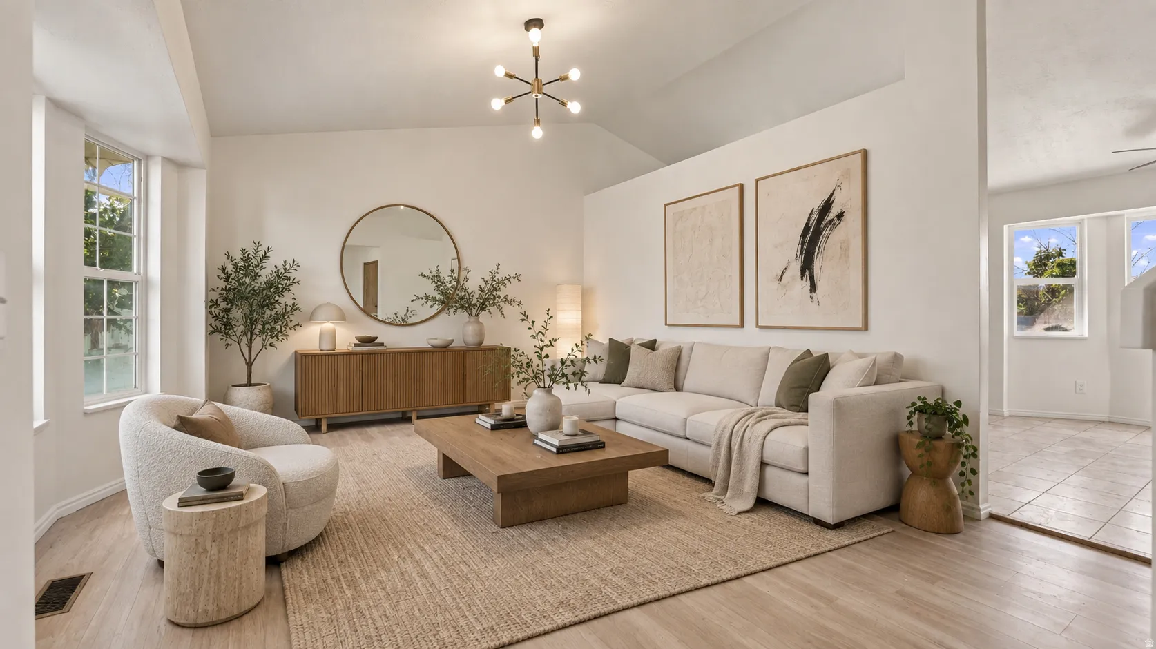 Vaulted ceiling, wood-finish flooring, bay window, built-in wooden sideboard, contemporary chandelier