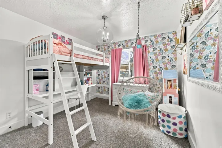 White loft bed with integrated desk and shelving