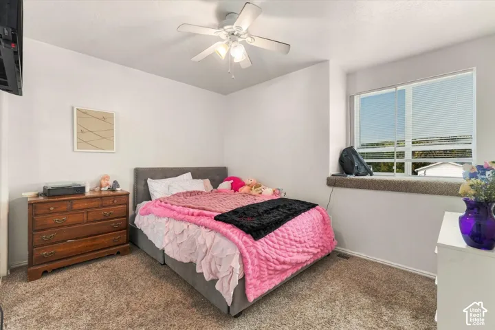 White walls complement the ceiling fan with integrated lighting