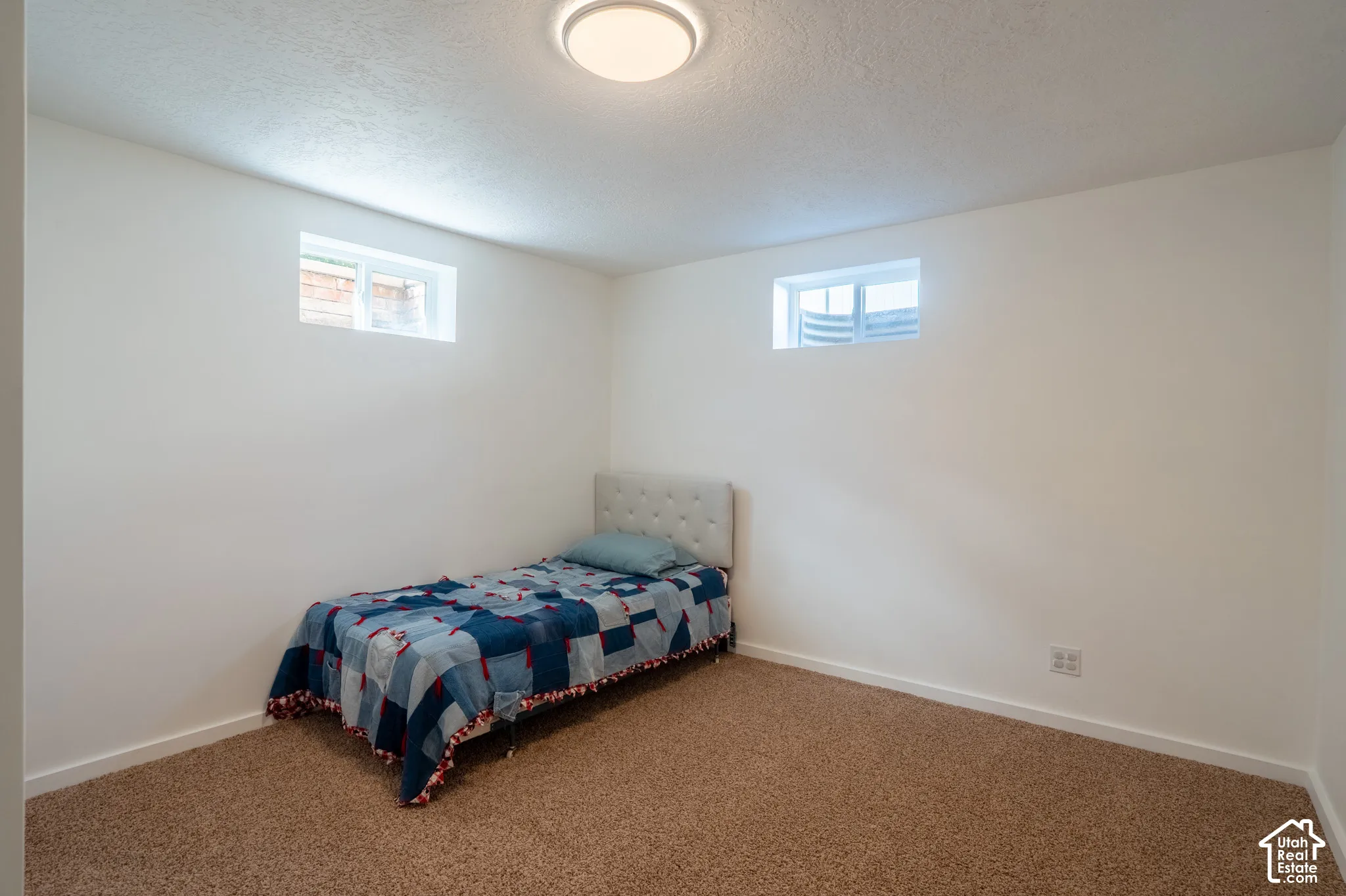 Bedroom 4 with windows and carpet.