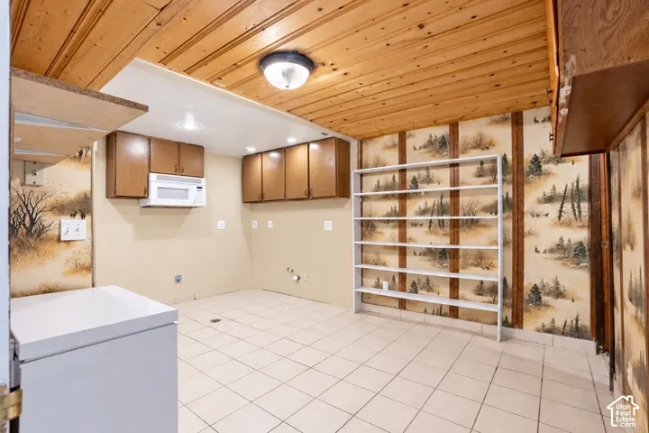 Wood-paneled ceiling with recessed lighting