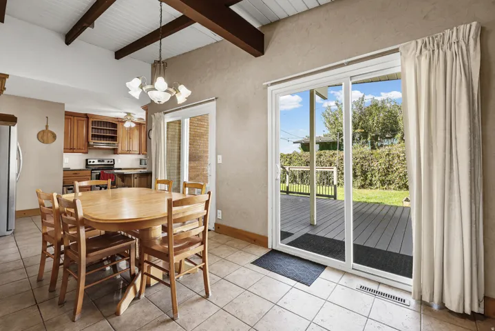 Vaulted Dining Room with Two Sets of Sliding Doors to Large Deck - Perfect for Entertaining